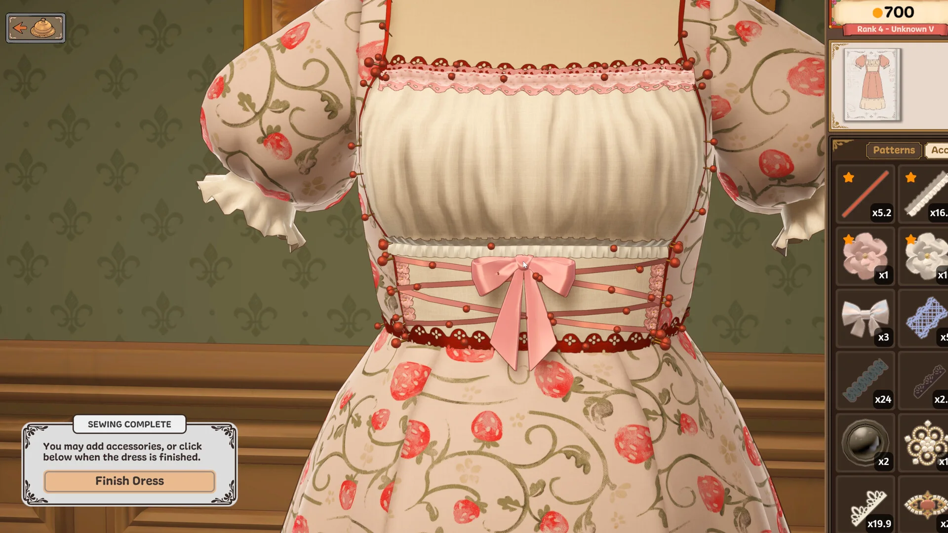 Accessory placement on a strawberry-print dress